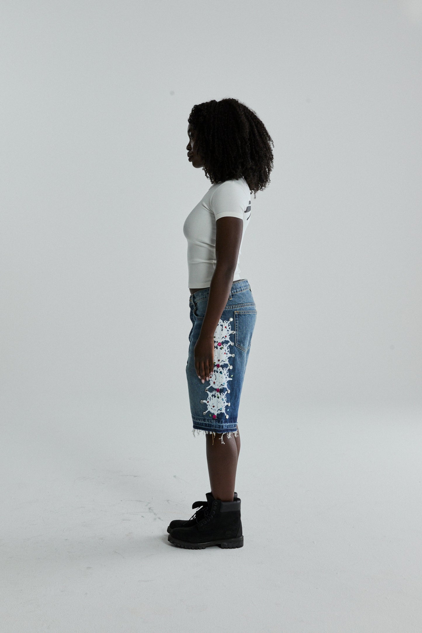 WHITE TM BABY TEE ON MODEL