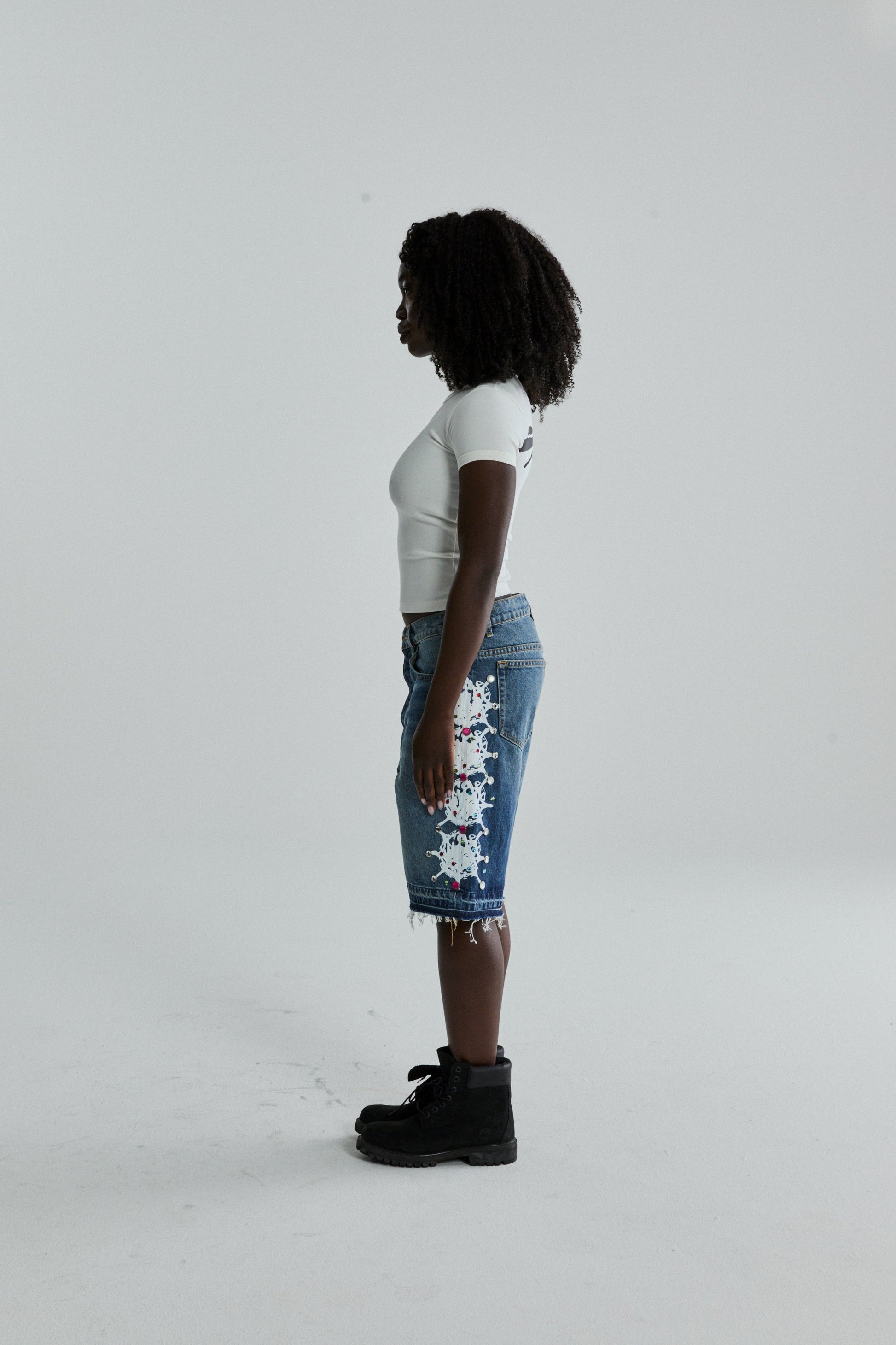 WHITE TM BABY TEE ON MODEL