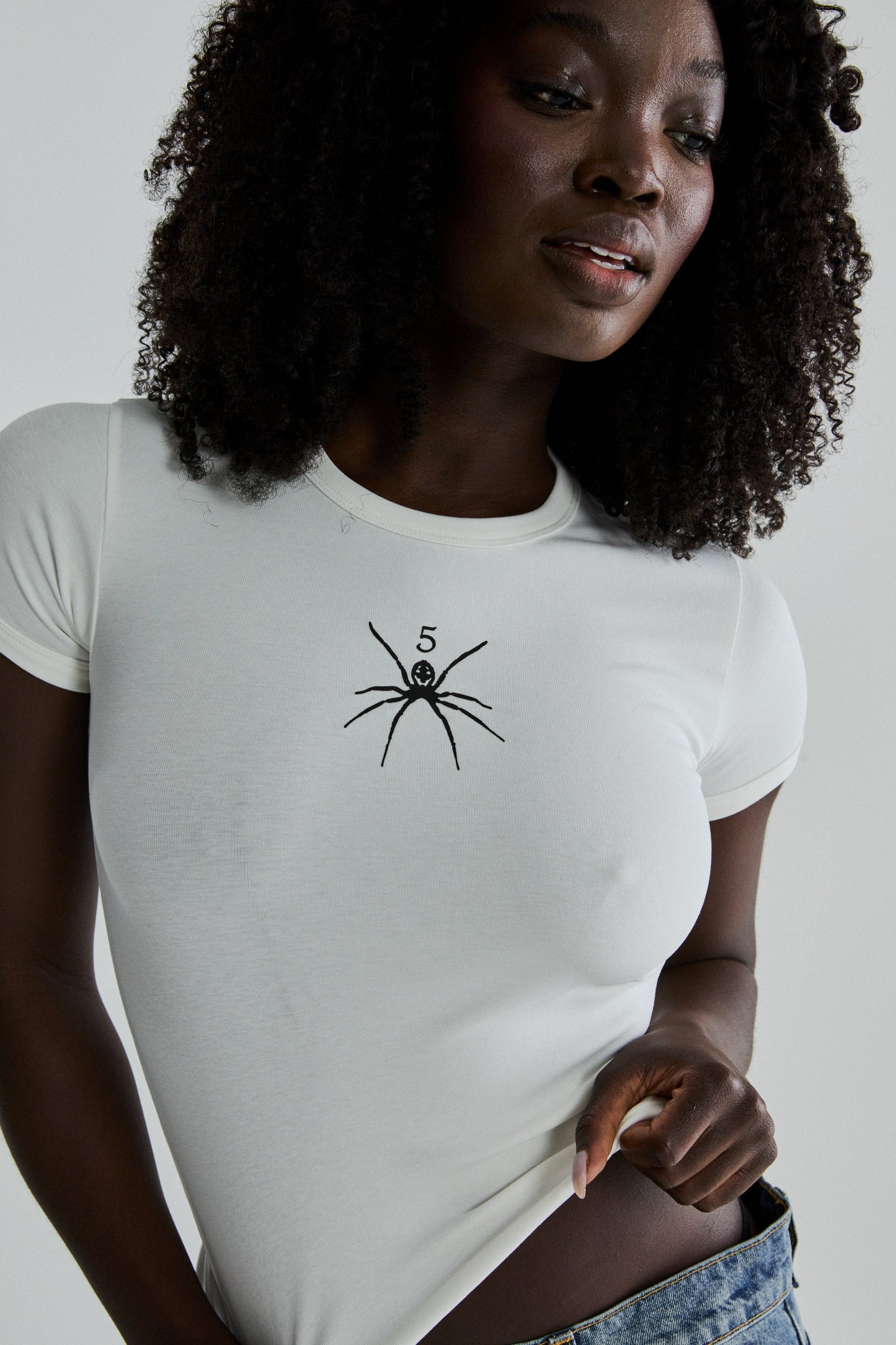 WHITE TM BABY TEE ON MODEL