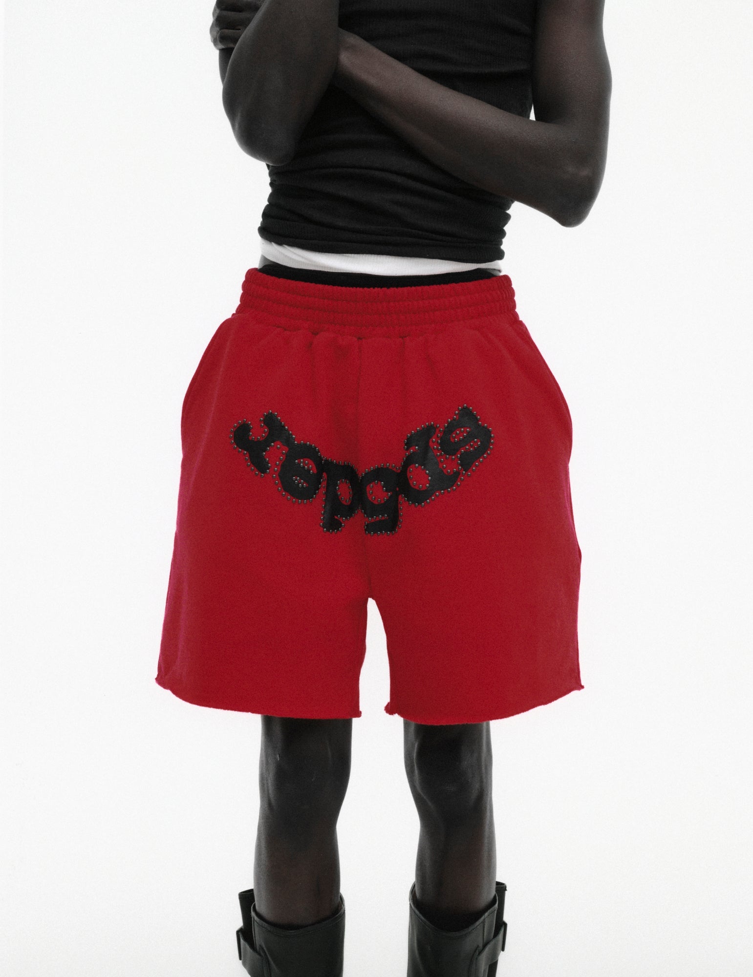 RED OG STUDDED SWEATSHORT ON MODEL