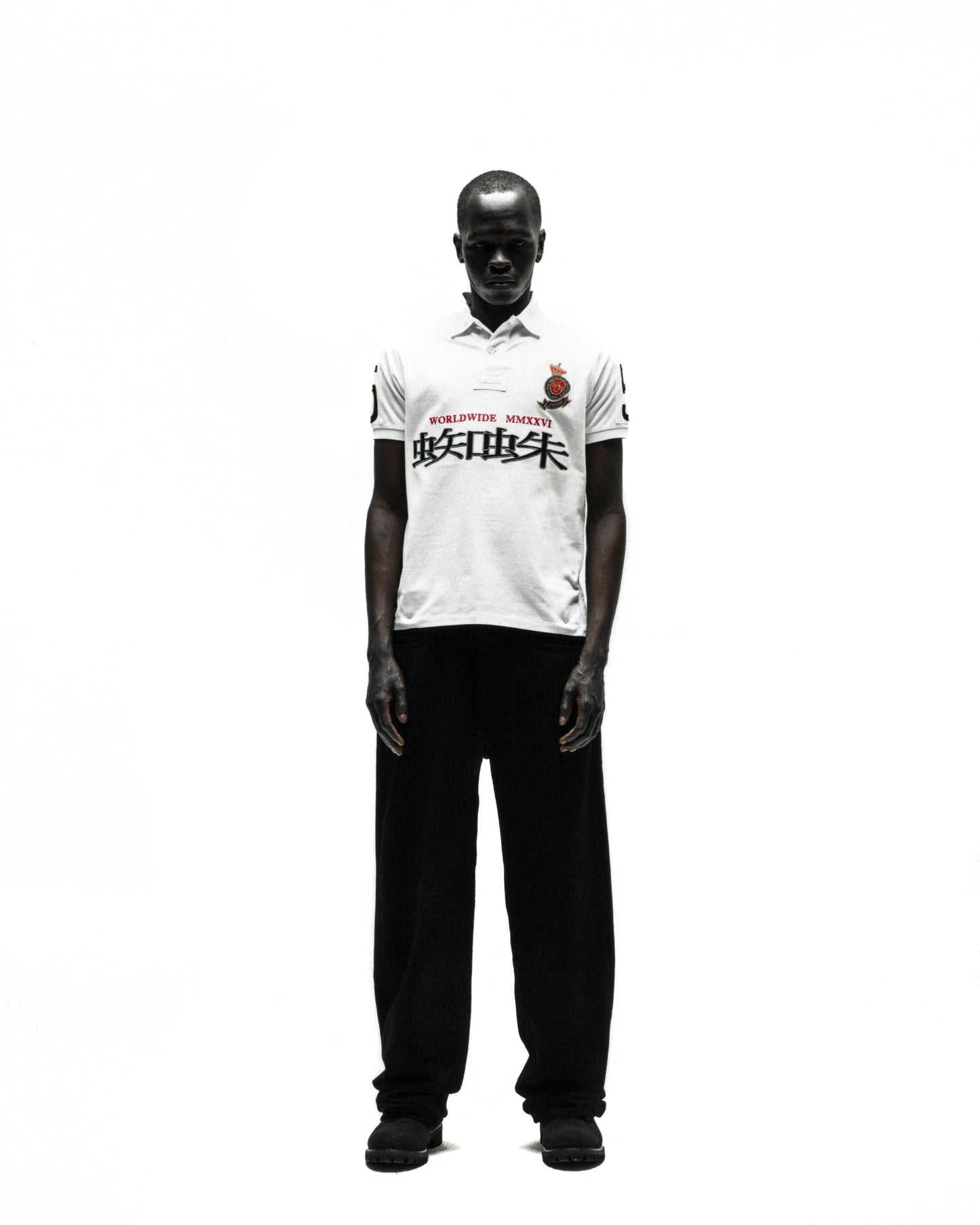 WORLDWIDE POLO white short-sleeve polo shirt with red rose crest and black text.