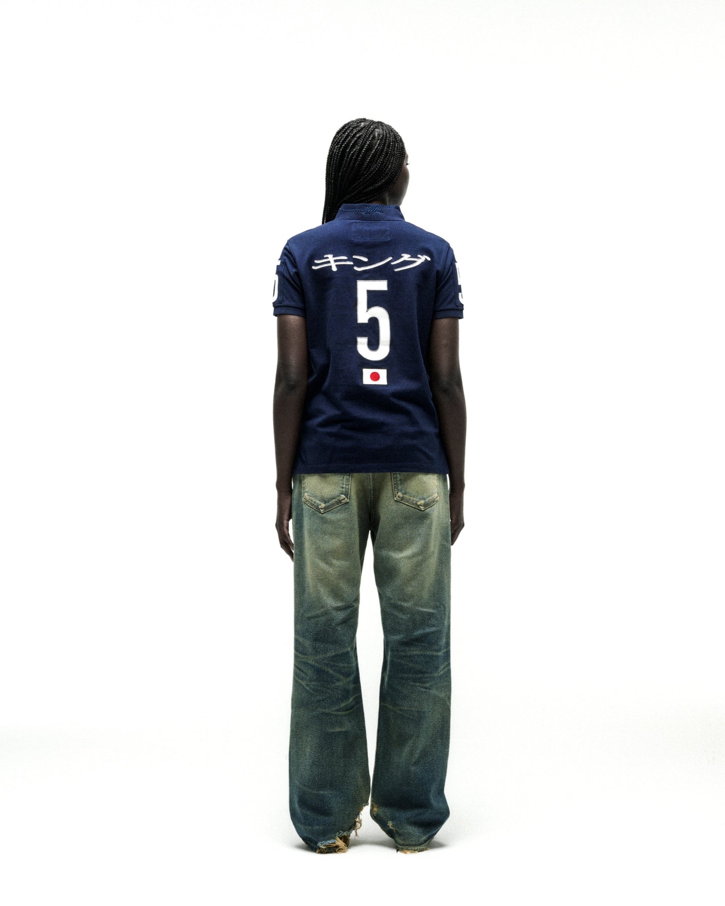 Navy blue polo shirt with white Japanese text, large "5", and a Japanese flag emblem on the back.