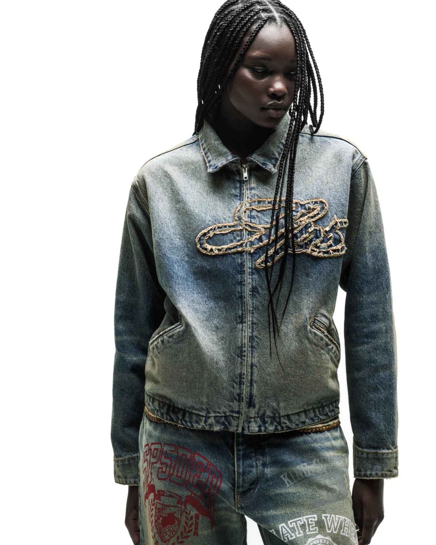 Washed blue denim work jacket with a gold chain script logo and full zipper.