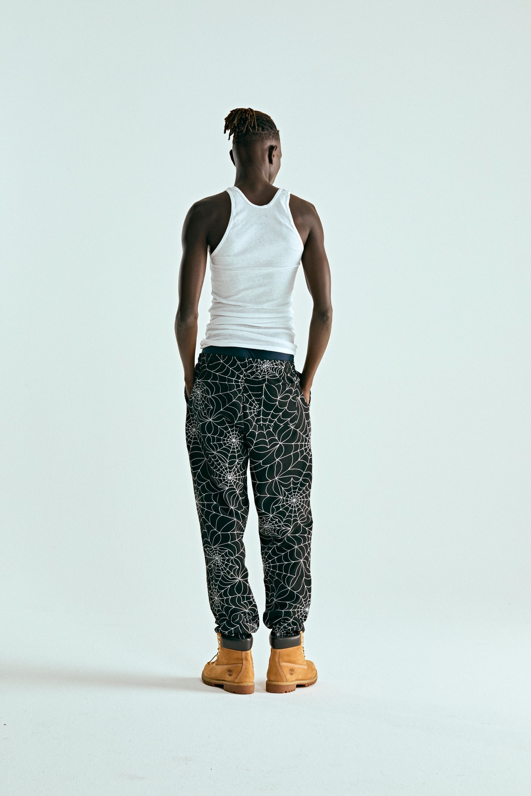 BLACK EMBROIDERED AOP SWEATPANT ON MODEL