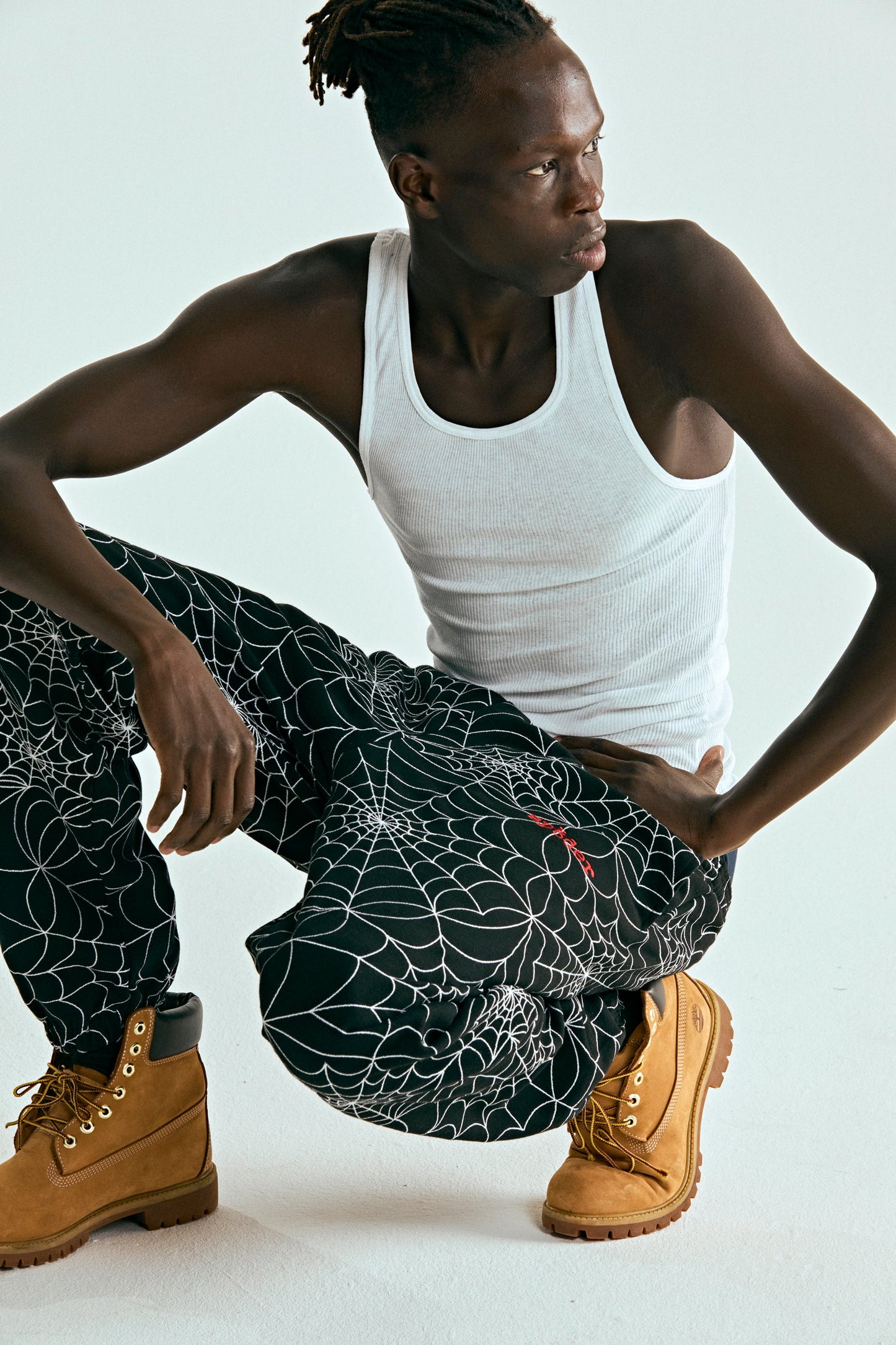 BLACK EMBROIDERED AOP SWEATPANT ON MODEL