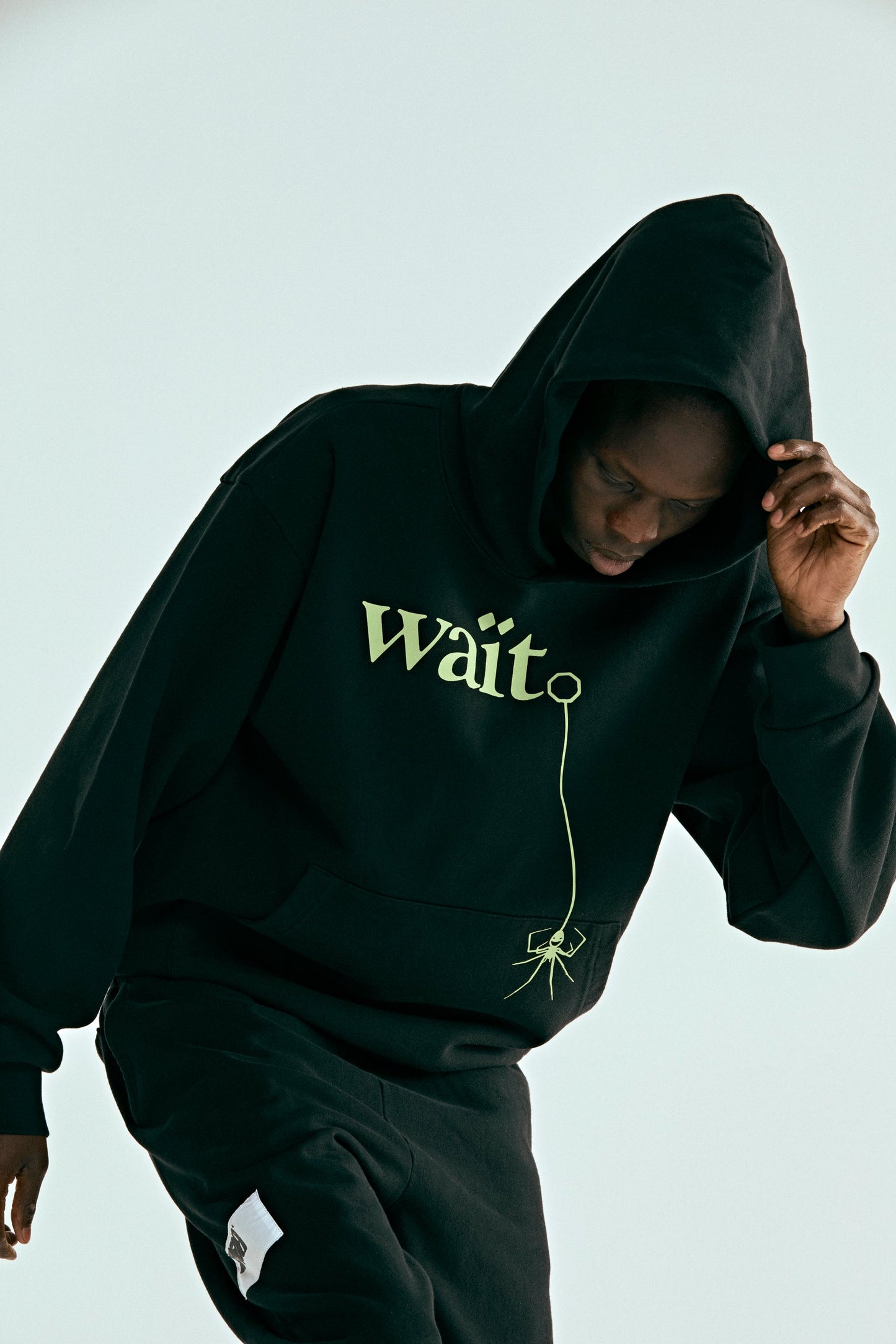 BLACK WAIT HOODIE ON MODEL