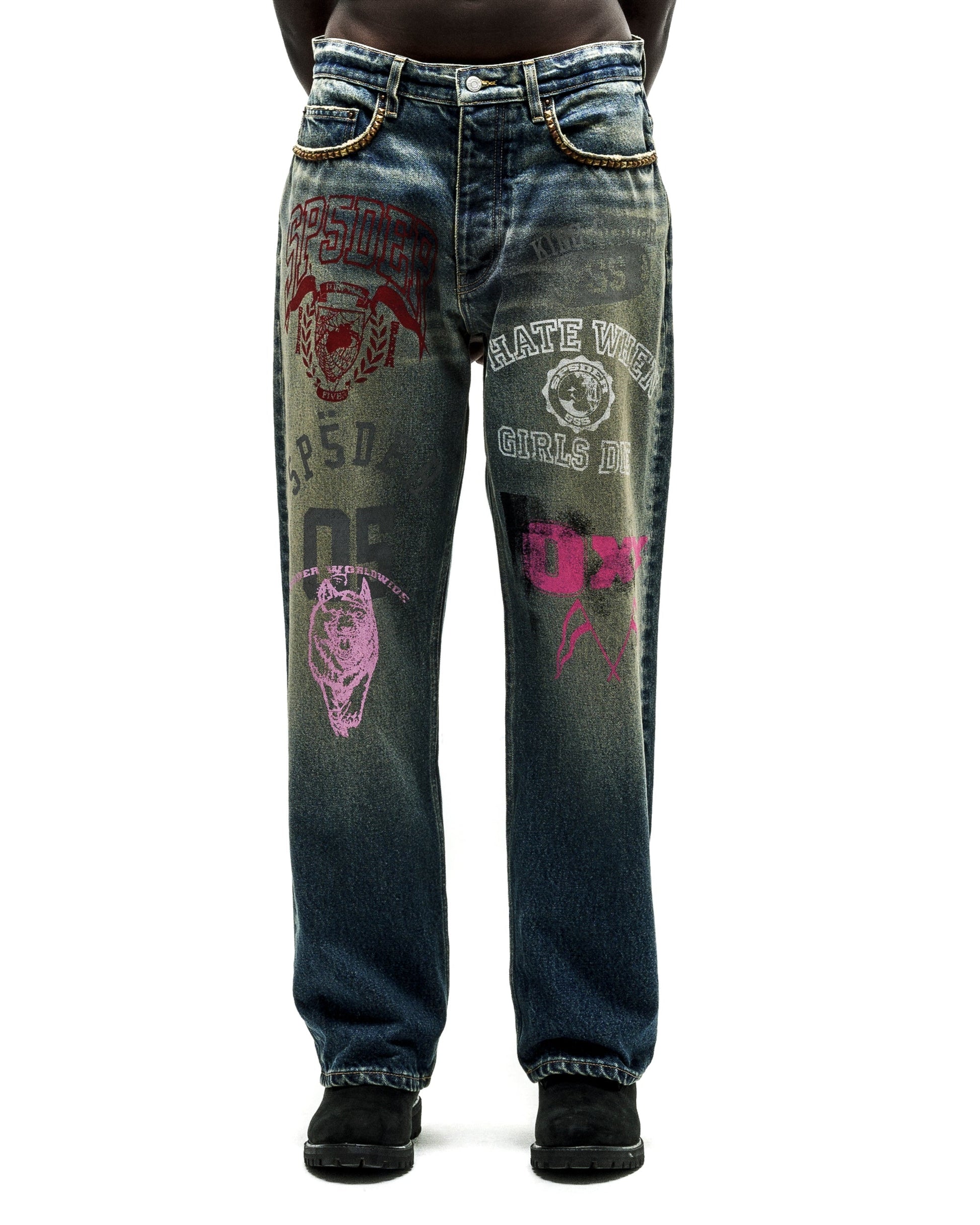 Distressed blue jeans with bold red, pink, and white graphic prints, chain details on the waist.
