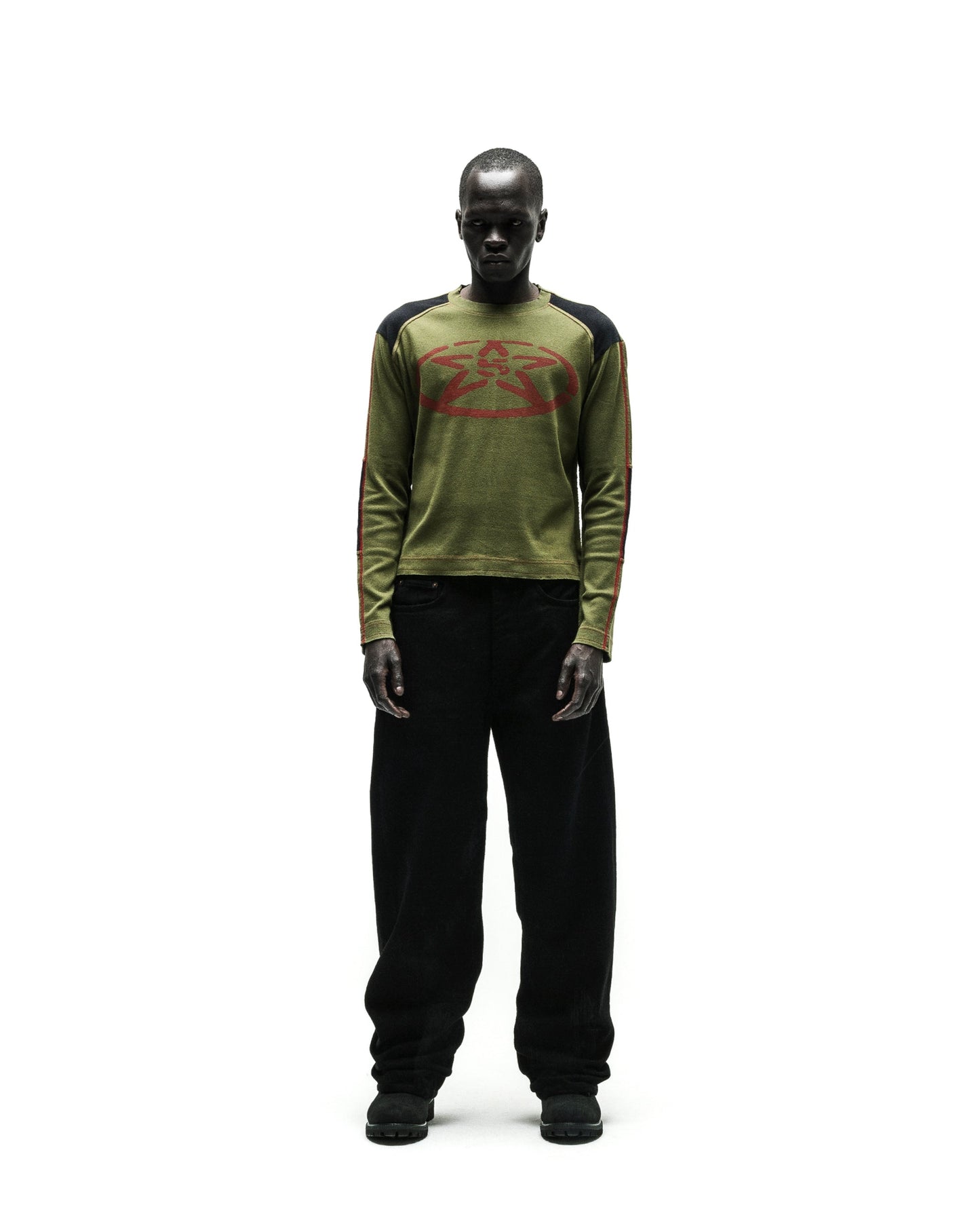 SERVICE LONGSLEEVE in olive green with red star graphic, black shoulders, and striped sleeves.
